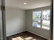 Cozy bedroom featuring wood flooring and a window with neighborhood views at 3007 Honeymyrtle Ln, Durham, NC 27703