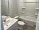 Clean bathroom with white fixtures, including a bathtub and a vanity, offering a fresh and modern feel at 3012 Honeymyrtle Ln, Durham, NC 27703