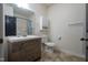 Bathroom with a modern vanity, sink, toilet, and a large mirror at 3031 Winston Dr # Apt 302, Burlington, NC 27215