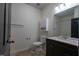Well-lit bathroom features vanity with a modern sink, cabinet storage, and a toilet at 3031 Winston Dr # Apt 302, Burlington, NC 27215