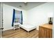 Bedroom with hardwood-style floors, a simple bed frame and ample natural light at 3031 Winston Dr # Apt 302, Burlington, NC 27215