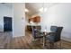 Inviting dining area with hardwood floors, a modern table, and a view into the contemporary kitchen at 3031 Winston Dr # Apt 302, Burlington, NC 27215