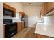 Modern kitchen featuring stainless steel appliances, wooden cabinets and white countertops at 3031 Winston Dr # Apt 302, Burlington, NC 27215