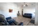Bright living room boasting stylish, hardwood-style floors, a ceiling fan, and contemporary furniture at 3031 Winston Dr # Apt 302, Burlington, NC 27215