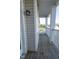 Classic porch featuring white columns and railings with wood decking and beautiful outside light at 3031 Winston Dr # Apt 302, Burlington, NC 27215