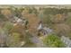 Aerial view of residential street showing a brick home with mature tree coverage at 3416 Cottonwood Dr, Durham, NC 27707