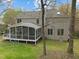 Two-story home with a screened in porch, deck and spacious backyard shaded by mature trees at 3416 Cottonwood Dr, Durham, NC 27707