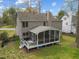 Aerial view of the home's backyard featuring a screened in porch, deck and spacious yard at 3416 Cottonwood Dr, Durham, NC 27707
