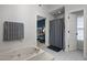 Ensuite bathroom visible from bedroom features a soaking tub with tile flooring at 3416 Cottonwood Dr, Durham, NC 27707