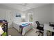 Bedroom with white walls, plush carpet, and natural light from a large window at 3416 Cottonwood Dr, Durham, NC 27707