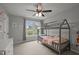 Bedroom with bed with canopy, neutral walls, and light-colored carpet at 3416 Cottonwood Dr, Durham, NC 27707