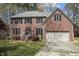 Charming two-story brick home with attached garage and manicured lawn at 3416 Cottonwood Dr, Durham, NC 27707