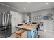 Modern kitchen features a center island, stainless steel appliances, and ample storage at 3416 Cottonwood Dr, Durham, NC 27707