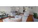 Bright living area with hardwood floors, neutral decor, comfortable seating, and a view into a home office at 3416 Cottonwood Dr, Durham, NC 27707