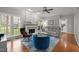 Cozy living room features a fireplace, hardwood floors, and modern furniture at 3416 Cottonwood Dr, Durham, NC 27707