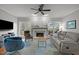 Bright living room boasts a fireplace, large windows, and comfortable seating at 3416 Cottonwood Dr, Durham, NC 27707