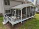 Outdoor porch with screen offers shade and space to relax and dine al fresco at 3416 Cottonwood Dr, Durham, NC 27707
