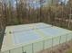 Overhead view of community tennis courts, surrounded by lush greenery at 3416 Cottonwood Dr, Durham, NC 27707