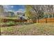 Backyard showing a home with a deck, a wood fence, and garden beds at 3501 Kensett Way, Raleigh, NC 27616