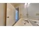 Bathroom featuring a vanity sink, white door, and mirror at 3501 Kensett Way, Raleigh, NC 27616