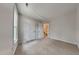 Bedroom showcasing neutral carpeting, white doors, and a window offering natural light at 3501 Kensett Way, Raleigh, NC 27616