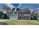 Charming two-story home featuring a two-car garage, brick accents, and a well-maintained front lawn at 3501 Kensett Way, Raleigh, NC 27616