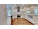 Modern kitchen featuring stainless steel appliances, white cabinetry, and a stylish subway tile backsplash at 3501 Kensett Way, Raleigh, NC 27616