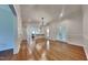 Bright and airy living room featuring gleaming hardwood floors and elegant French doors at 3501 Kensett Way, Raleigh, NC 27616