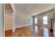 Inviting living room boasting hardwood floors, large windows, and classic trim at 3501 Kensett Way, Raleigh, NC 27616