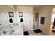 Bathroom featuring double sinks, storage, and a glass-enclosed shower at 404 Braxman Ln, Holly Springs, NC 27540