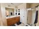 Bathroom with double sinks, a glass shower, and plenty of cabinet space at 404 Braxman Ln, Holly Springs, NC 27540