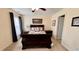 Bedroom with queen size bed, two side tables, and a window with blinds and curtains at 404 Braxman Ln, Holly Springs, NC 27540