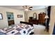 Bedroom featuring a star themed bedspread, ceiling fan and access to the adjacent bathroom at 404 Braxman Ln, Holly Springs, NC 27540