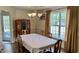 Traditional dining room with hardwood floors, chandelier, and classic furnishings at 404 Braxman Ln, Holly Springs, NC 27540
