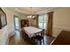 Traditional dining room with hardwood floors, chandelier, and classic furnishings at 404 Braxman Ln, Holly Springs, NC 27540