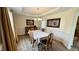 Traditional dining room with hardwood floors, chandelier, and classic furnishings at 404 Braxman Ln, Holly Springs, NC 27540