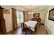 Traditional dining room with hardwood floors, chandelier, and classic furnishings at 404 Braxman Ln, Holly Springs, NC 27540