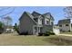 View of a two-story home showcasing a well-maintained lawn at 404 Braxman Ln, Holly Springs, NC 27540