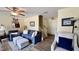Inviting living room features soft neutral walls, wood floors and plush furniture at 404 Braxman Ln, Holly Springs, NC 27540