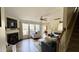 Cozy living room with a fireplace, ceiling fan, and comfortable seating at 404 Braxman Ln, Holly Springs, NC 27540