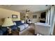 Cozy living room with plush seating, fireplace, and view of the staircase at 404 Braxman Ln, Holly Springs, NC 27540