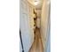 Walk in pantry with wooden shelves for food storage at 404 Braxman Ln, Holly Springs, NC 27540