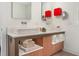 Modern bathroom featuring double sinks, stylish fixtures, and decorative red wall boxes at 407A Hillsborough St, Chapel Hill, NC 27514