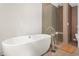 Elegant bathroom showcasing a freestanding tub and a glass enclosed shower with modern fixtures at 407A Hillsborough St, Chapel Hill, NC 27514