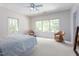 Spacious bedroom with carpet, ceiling fan, natural light and seating area at 407A Hillsborough St, Chapel Hill, NC 27514