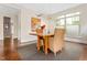 Inviting dining area featuring a wood table, seating for six, and ample natural light at 407A Hillsborough St, Chapel Hill, NC 27514