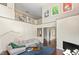 Open-concept living area with high ceilings and a view of the staircase at 407A Hillsborough St, Chapel Hill, NC 27514