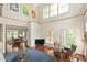 Open-concept living area featuring high ceilings, comfortable seating, and access to the dining room at 407A Hillsborough St, Chapel Hill, NC 27514