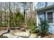 Backyard view with a tranquil koi pond, lush greenery, and a serene outdoor setting at 410 N Currie Dr, Sanford, NC 27330