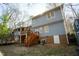 Exterior of blue home featuring a deck, patio, and spacious backyard at 410 N Currie Dr, Sanford, NC 27330